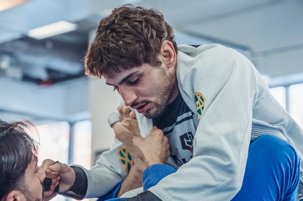 Two students drilling guard passing in the Gi