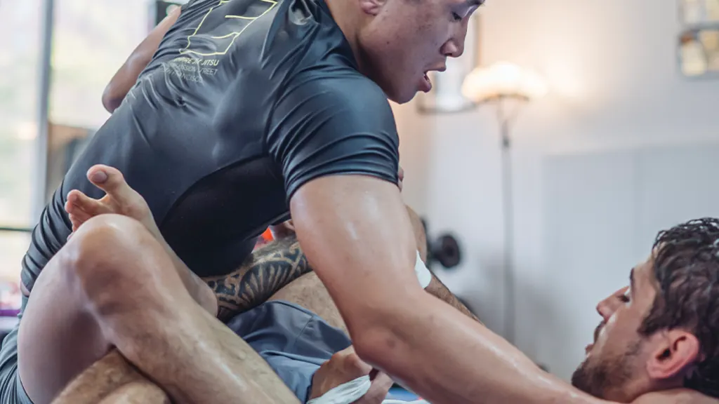 Students training No-Gi in rash guards